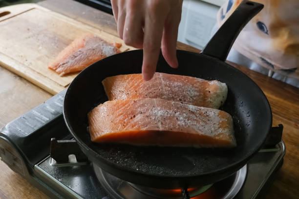 istock Frying red fish in pan. Pieces of red fish. 1167332966