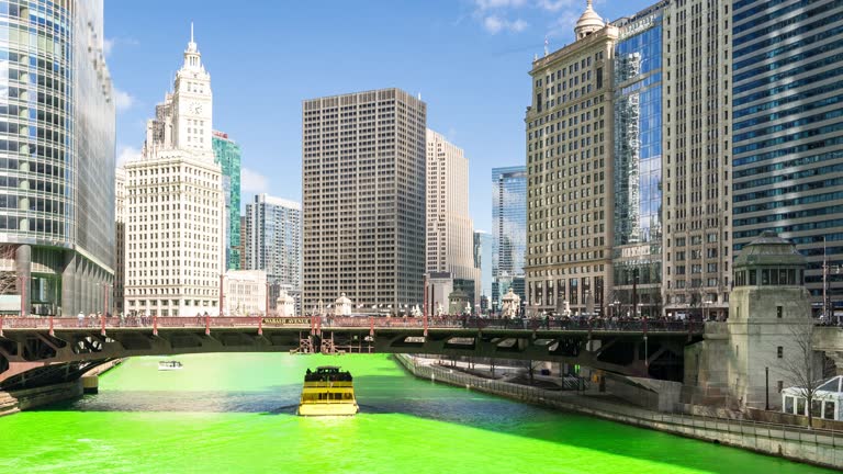 4K Time-lapse: Chicago River dyeing river green with Skyline Cityscape on St patrick's day in Chicago IL USA, Apple ProRes 422 (HQ) 3840x2160 Format