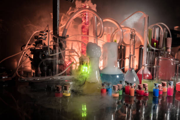 istock Pharmacy and chemistry theme. Test glass flask with solution in research laboratory. Science and medical background. Laboratory test tubes on dark toned background 1167334290