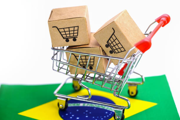 쇼핑 카트 로고와 브라질 플래그 상자 : 수입 수출 쇼핑 온라인 또는 전자 상거래 배달 서비스 상점 제품 배송, 무역, 공급 업체 개념. - selling e commerce sale internet 뉴스 사진 이미지
