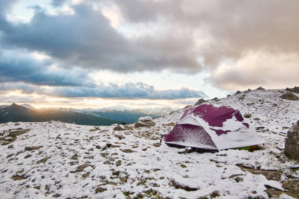 istock Purple tent under snow in the mountains 1167338055