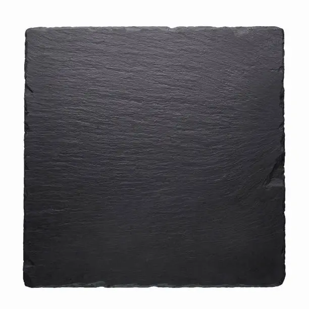 Photo of Black stone square tile isolated at white background.