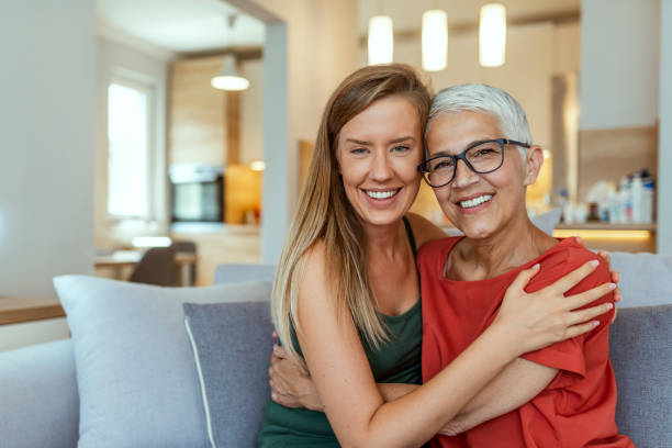 istock Woman hugging mother with love 1167338102