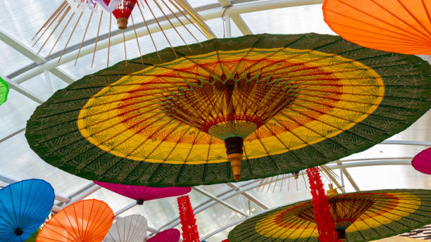istock Colorful paper umbrellas hanging from the ceiling 1167339125
