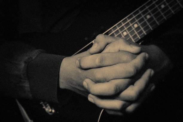 The guitar player Jazz, Folk music, vintage, guitar, Blues music, passion, Rock Music, church music church black and white people praying stock pictures, royalty-free photos & images