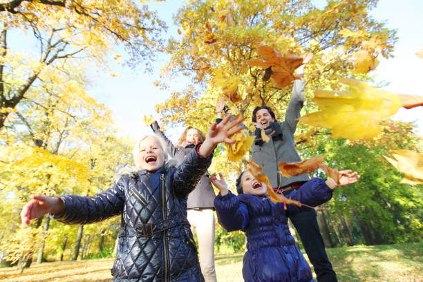 istock Family playing in autumn park 1167339310