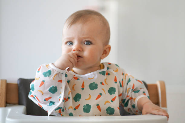 istock Little baby eating her snack herself 1167340437