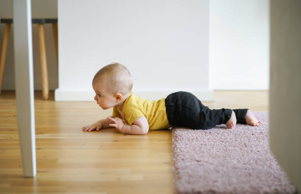 istock Little baby crawling at home. 1167340538