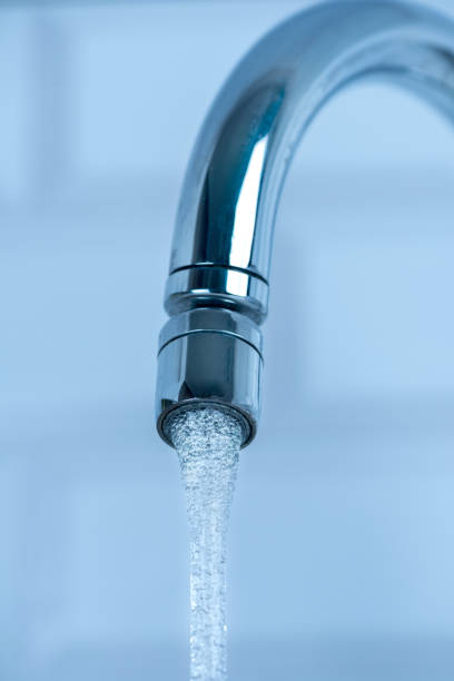 istock Pouring water from a Faucet 1167342071