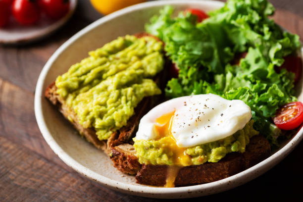 istock Rye toast with avocado cream and poached egg 1167344036