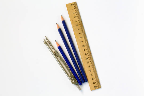 istock wooden ruler and pencils isolated on white background top view 1167348363
