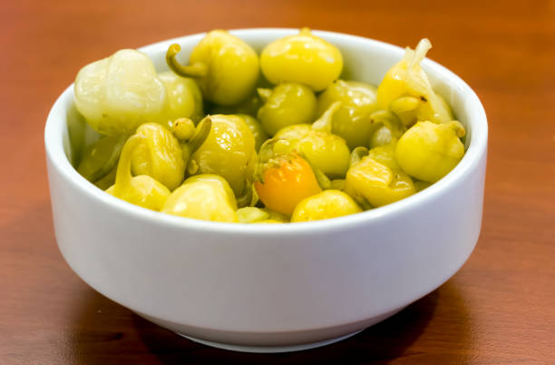 istock Marinated yellow hot pepper pickle in white plate 1167348383