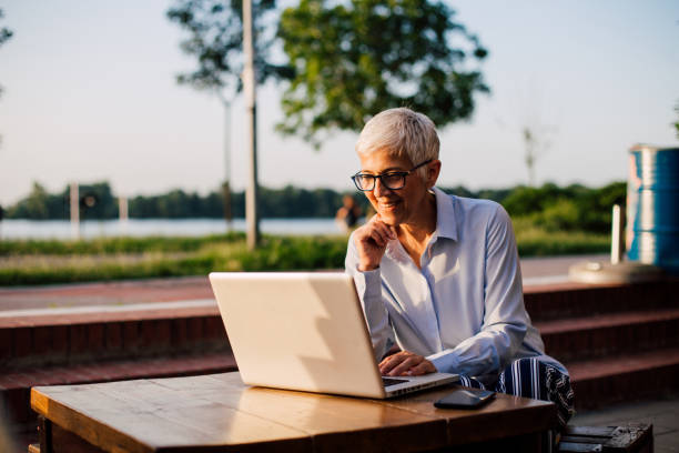 istock Senior woman working at the cafe 1167351580