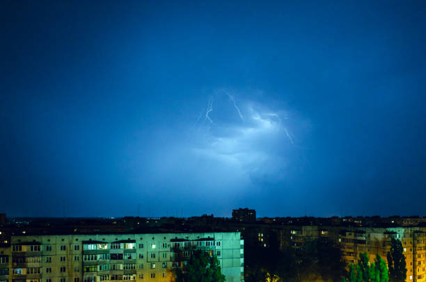 istock Thunderstorm with lightning and thunder over the night city 1167352660