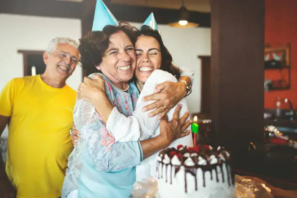 Family together preparing a surprise birthday party