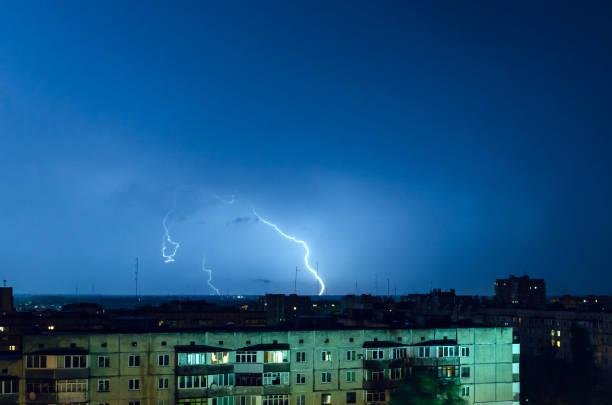 istock Thunderstorm with lightning and thunder over the night city 1167354371