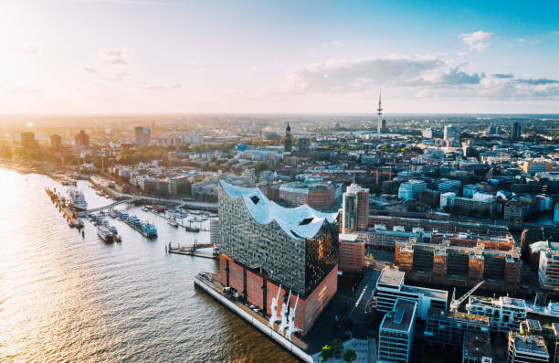 Aerial view of Hamburg Hafen City and Elbphilharmonie Hamburg, Germany - July 03, 2019:  Aerial  view on the Elbe river towards Elbphilharmonie at sunset elbphilharmonie photos stock pictures, royalty-free photos & images