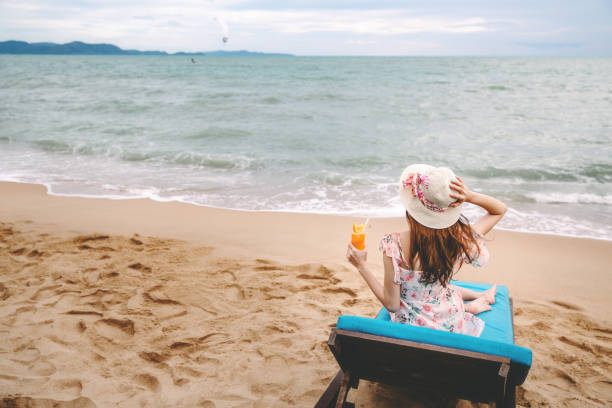 istock Woman on beach in summer 1167356403