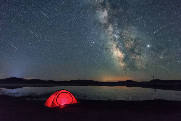 The Perseid meteor shower in 2019 in the wild duck lake in China's Mongolian steppe The Perseid meteor shower in 2019 in the wild duck lake in China's Mongolian steppe meteor shower stock pictures, royalty-free photos & images