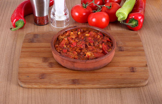 istock Serving fresh meat in earthenware dish with red and green pepper 1167357618
