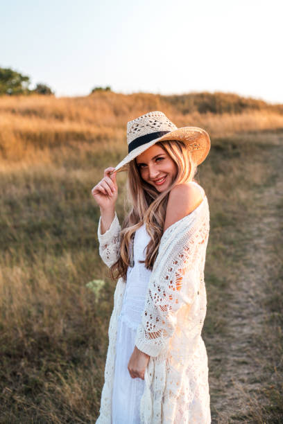 istock Beautiful woman enjoying nature outdoors at sunset. 1167361027