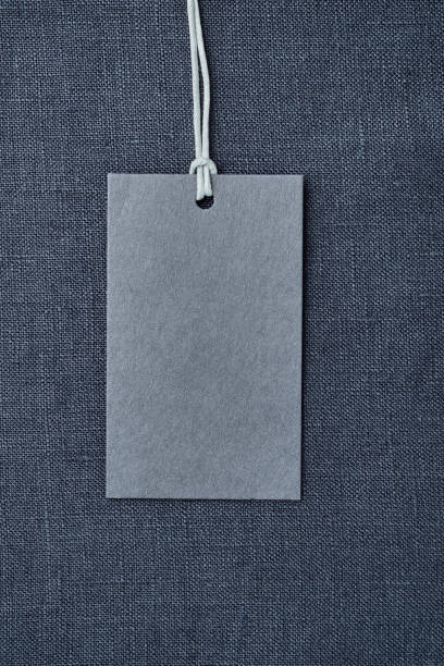 istock Blank paper label on blue linen clothes background 1167362532