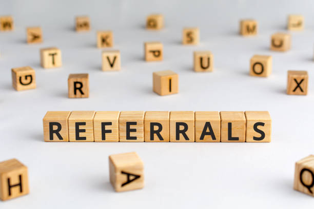 referrals - word from wooden blocks with letters stock photo