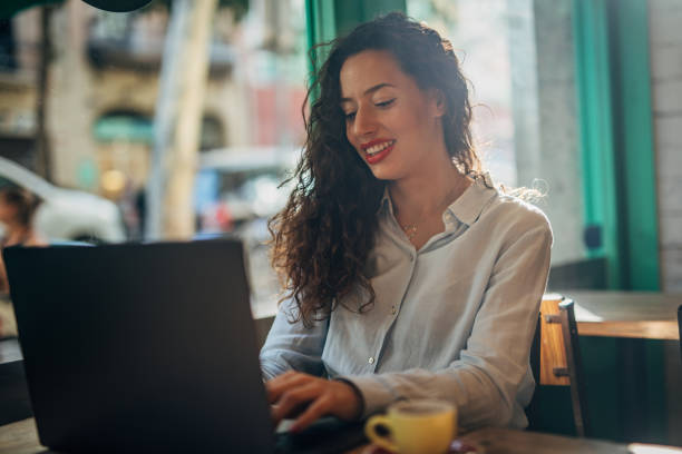 istock Businesswoman Using Laptop In Cafe 1167376758