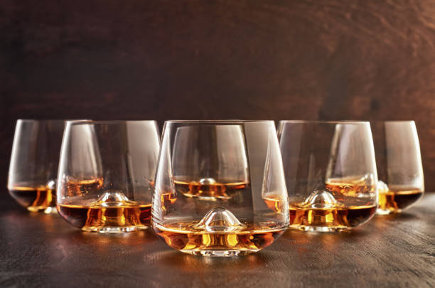 istock Crystal glass with whiskey on a wooden table 1167378458