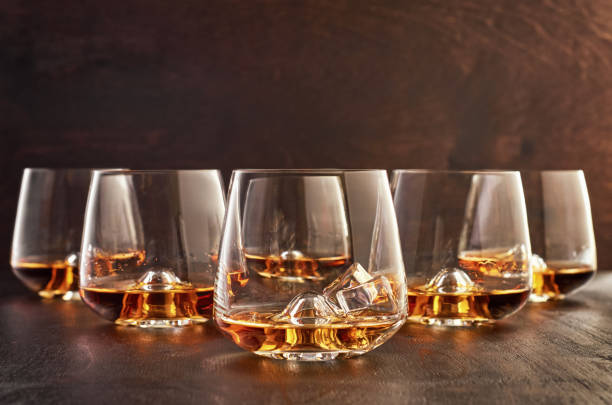 istock Crystal glass with whiskey on a wooden table 1167378467