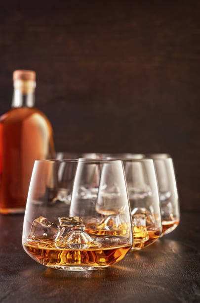 istock Crystal glass with whiskey on a wooden table 1167378606