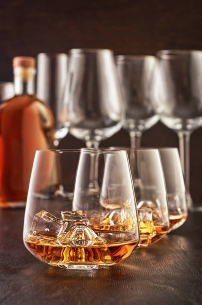 istock Crystal glass with whiskey on a wooden table 1167378621