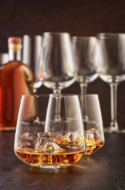 istock Crystal glass with whiskey on a wooden table 1167378632