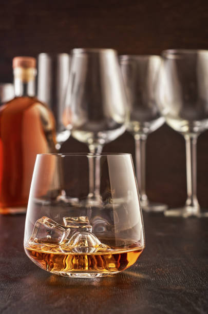istock Crystal glass with whiskey on a wooden table 1167378641