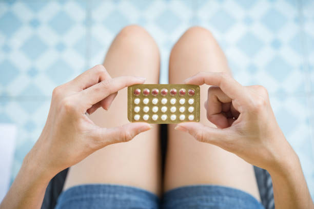 Woman hand holding a contraceptive panel prevent pregnancy stock photo