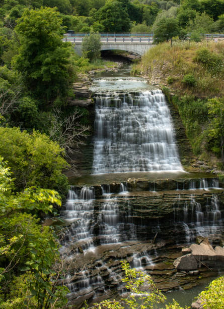 istock Classic multi tiered cascade waterfalls surrounded by lush green vegetation. 1167388800