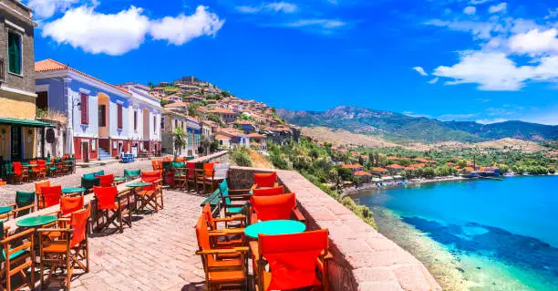 Photo of Traditional colorful Greece series - street bars and taverns of Molivos town, Lesvos island