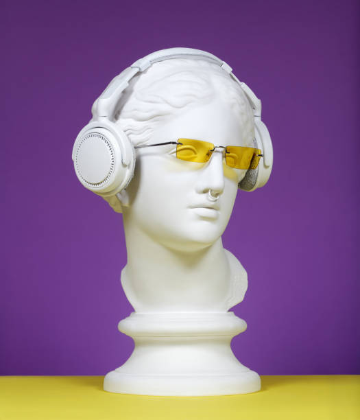 modern greek goddess with sunglasses and headphones - classical greek audio imagens e fotografias de stock