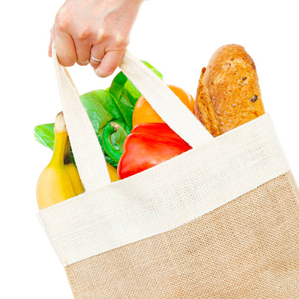 istock Canvas bag of groceries isolated on white 1167392608