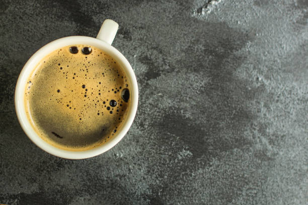 istock coffee freshly brewed in a white cup serving of beverage (coffee grain). food. top. copy save 1167393839