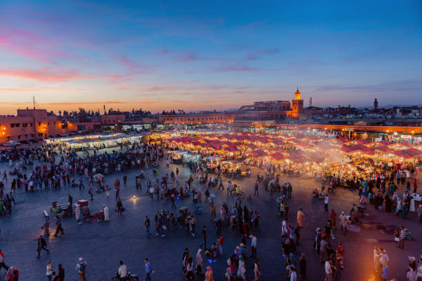 Evening Djemaa El Fna Square with Koutoubia Mosque, Marrakech, Morocco,North Africa Evening Djemaa El Fna Square with Koutoubia Mosque, Marrakech, Morocco,North Africa,Nikon D3x djemma el fna square stock pictures, royalty-free photos & images