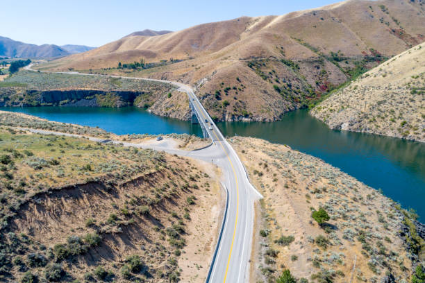 istock Highway leads over a bridge in Idaho where there is a reservoir 1167400496