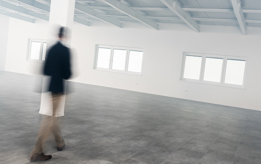 Male Architect In Modern Empty Office, Blurred Motion