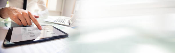 istock Businessperson Analyzing Invoice On Digital Tablet 1167402256