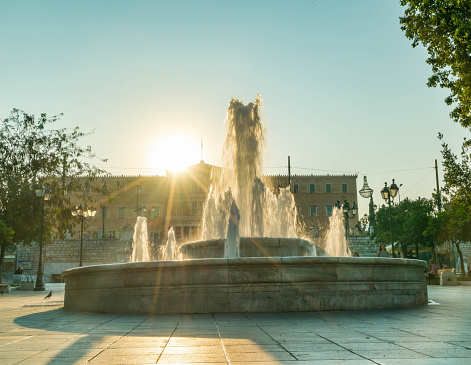 Sunrise over fountain in Syntagma Square in Athens, Greece.