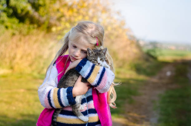 istock child walking with his cute cat alone 1167403686