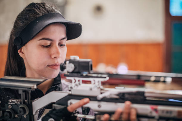 istock Girl with a machine gun 1167405291