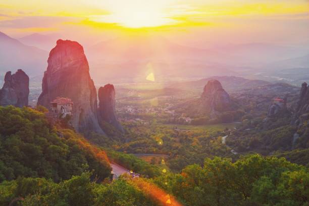 istock Monastery Meteora Greece. Stunning summer panoramic landscape. View at mountains and green forest against epic blue sky with clouds. UNESCO heritage list object. 1167405386