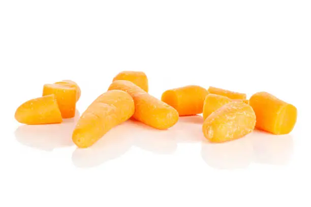 Photo of Orange baby carrot isolated on white