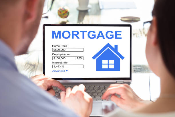 istock Two Businesspeople Looking At House 1167409864